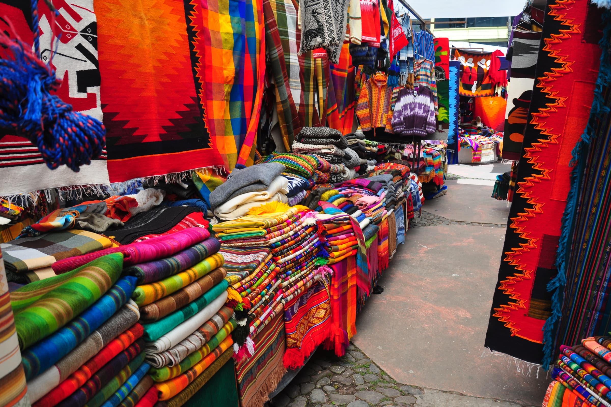Textile and market experience in Otavalo, Ecuador with artisan detail